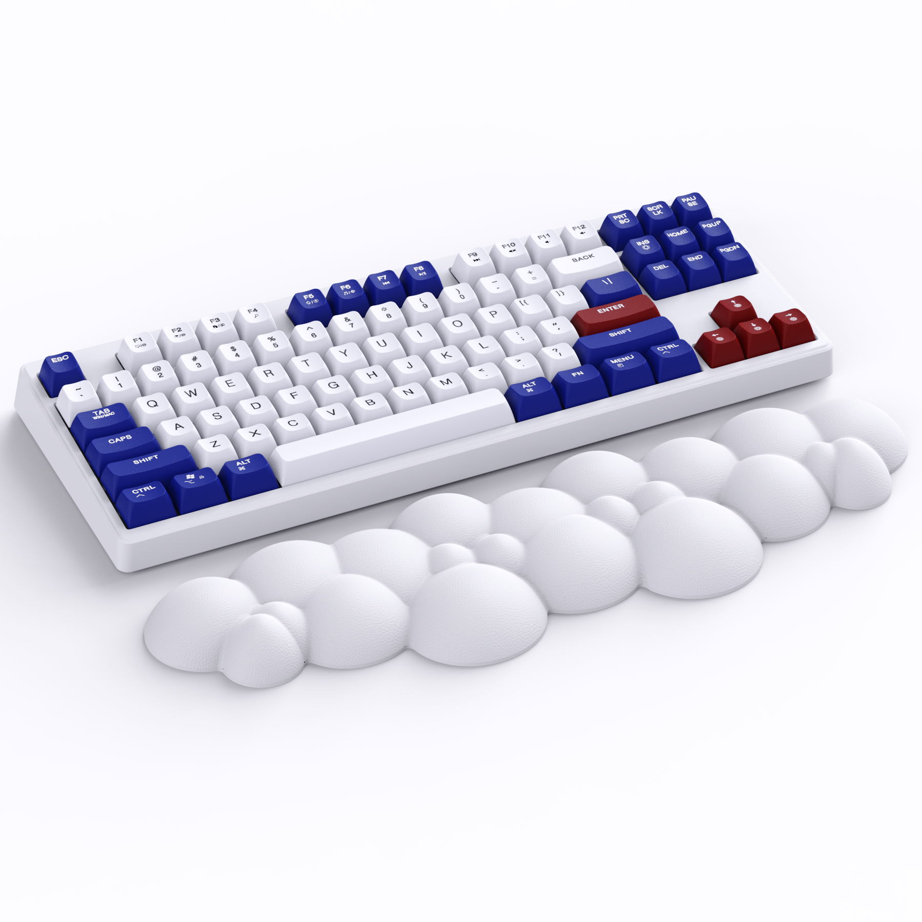 Cloud-shaped wrist rest with ergonomic design beside a mechanical keyboard.